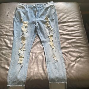 Light washed jeans w/ rips down the leg